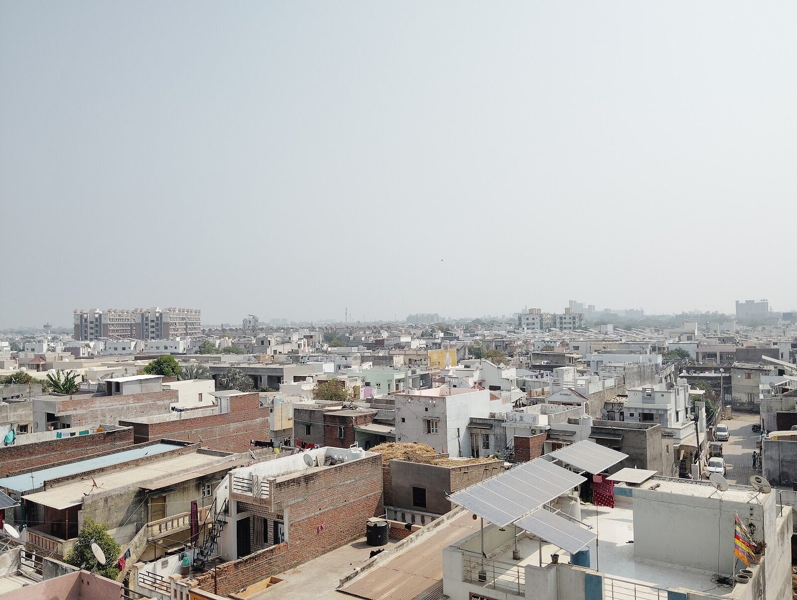 Aerial view of rooftops fitted with solar panels